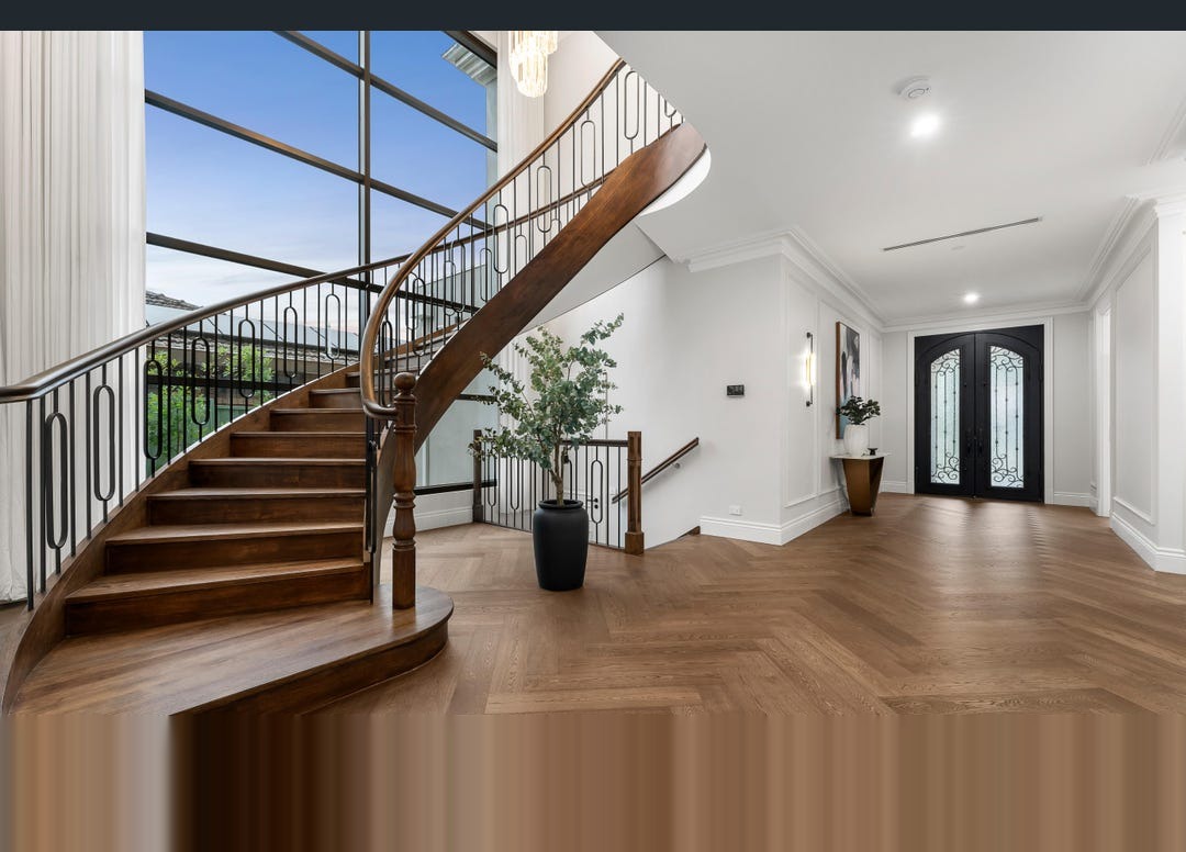 Dramatic staircase with floor-to-ceiling aluminium feature windows - Doncaster East