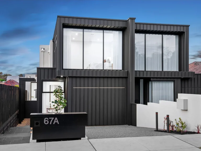 Completed Hampton facade with large black aluminium windows by Iconic Windows