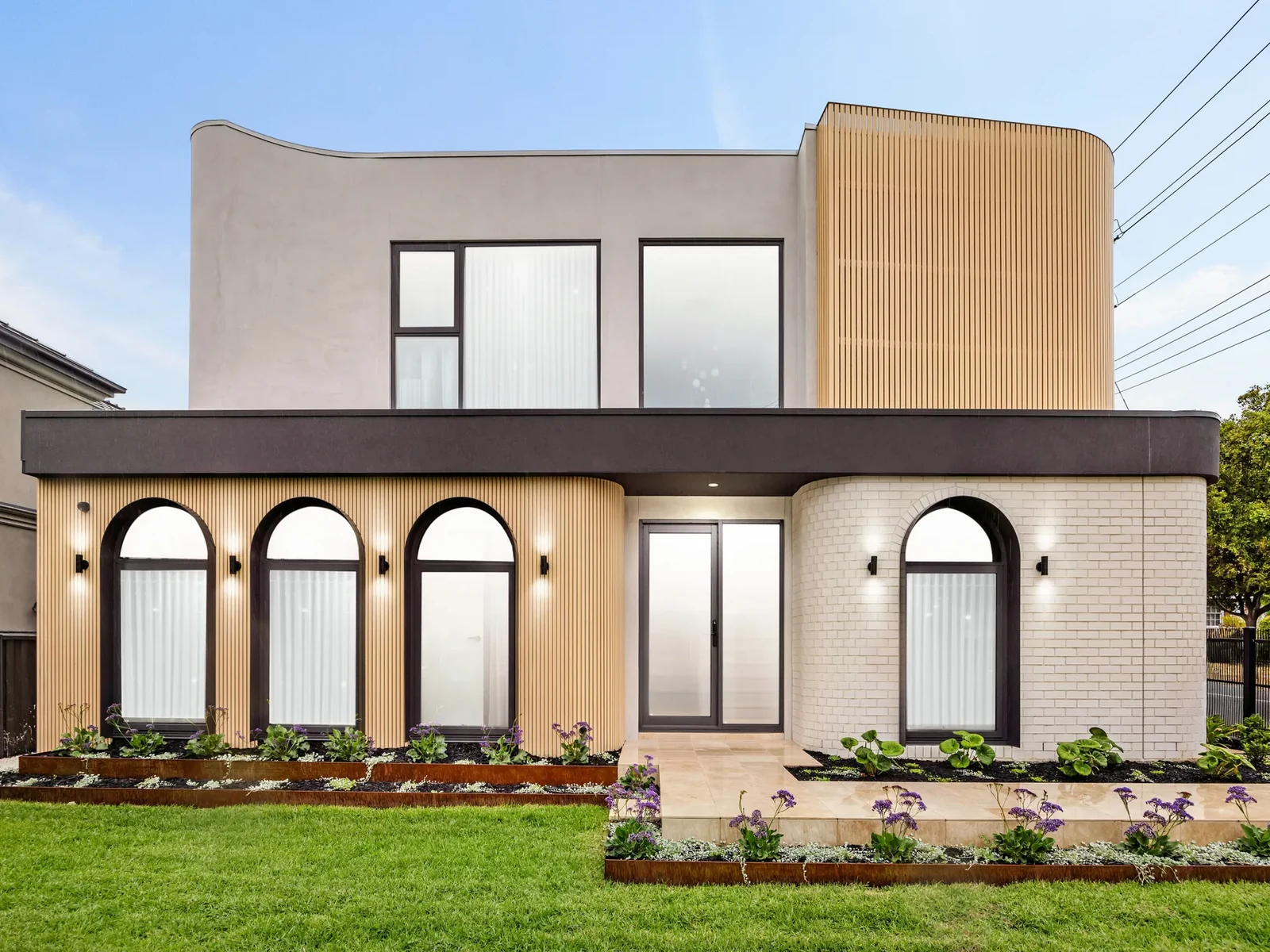 Completed Ashburton home with custom arched and rectangular black aluminium windows
