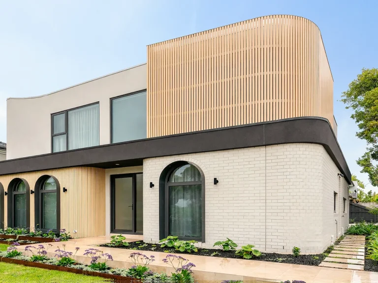 Completed Ashburton facade with custom aluminium windows and curved architectural detailing