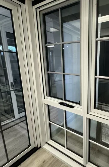 White aluminium awning windows with opening hardware at the Iconic Windows showroom