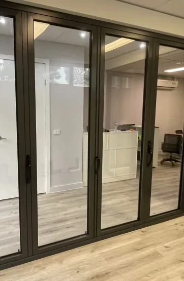 Black aluminium multi-panel folding door display at the Iconic Windows showroom