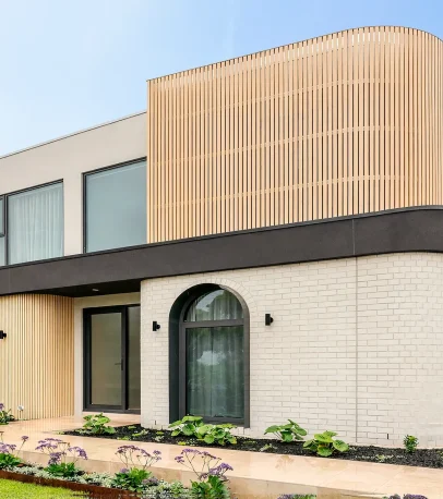 Completed Ashburton facade with custom aluminium windows and curved architectural detailing
